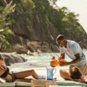 four-seasons-resort-mahe-guests-lounge-at-beach