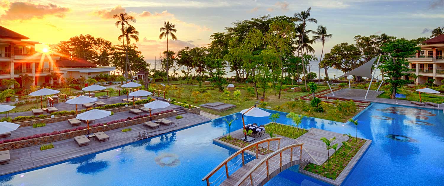 Savoy Seychelles Resort view pool at sunset