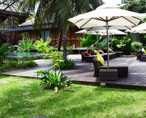 Dhevatara-Beach-Hotel-garden-with-seating-area Dhevatara-Beach-Hotel-garden-with-seating-area